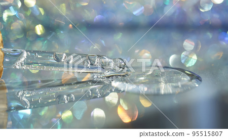 A pipette with a drop of serum in a Christmas theme . 95515807