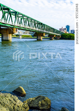 Hankyu Senri Line Yodogawa Bridge and Nagara Aqueduct Bridge over the Yodo River in Osaka Prefecture 95516048