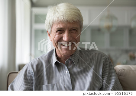 Happy senior man laughing staring at camera, headshot Happy senior man laughing staring at camera, headshot 95516175