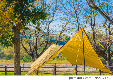 Tarp tent setup campsite image material 95517139