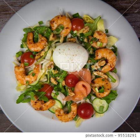 Recipe for rocket salad, endive, tomato, cucumber, soft-boiled egg, fried shrimp with paprika Recipe for rocket salad, endive, tomato, cucumber, soft-boiled egg, fried shrimp with paprika 95518291