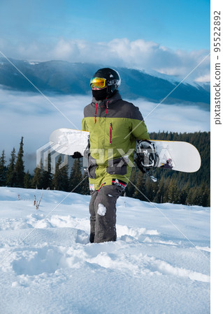 man snowboarder portrait carpathian mountains on background man snowboarder portrait carpathian mountains on background 95522892
