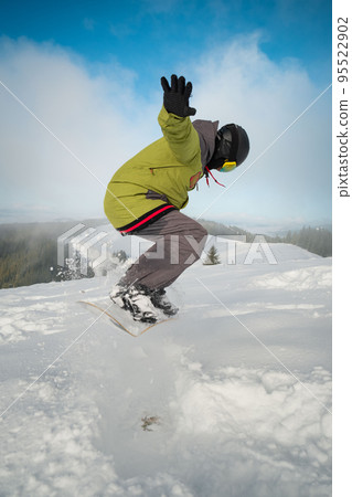 man snowboarder portrait carpathian mountains on background 95522902