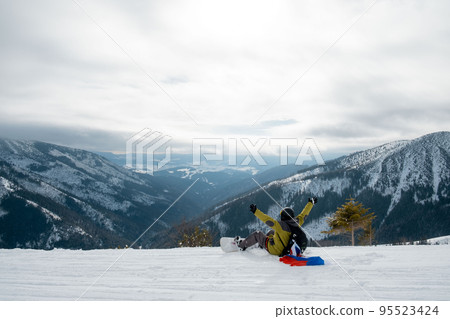 man snowboarder with slovakia flag at ski resort slope 95523424