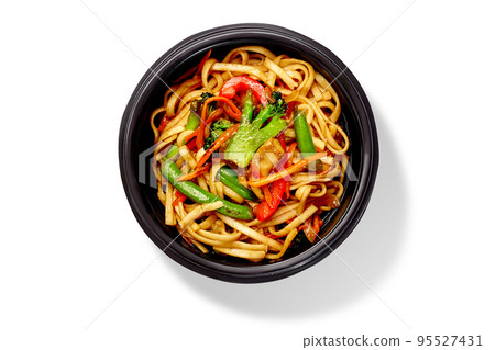Bowl of spicy stir fried udon noodles with broccoli, bell peppers, green beans and mushrooms Bowl of spicy stir fried udon noodles with broccoli, bell peppers, green beans and mushrooms 95527431