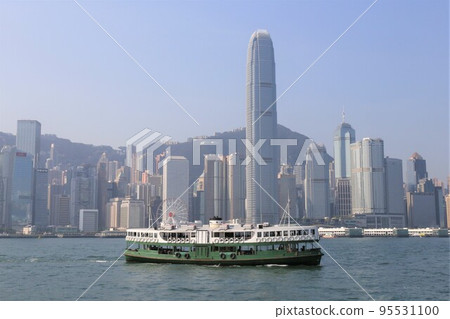 Star ferry sailing through Victoria Bay in Hong Kong 95531100
