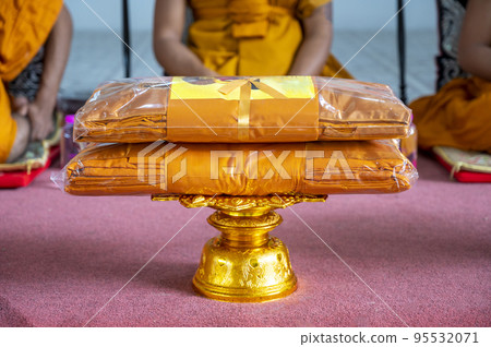 set of monk's robes placed on the pedestal set of monk's robes placed on the pedestal 95532071