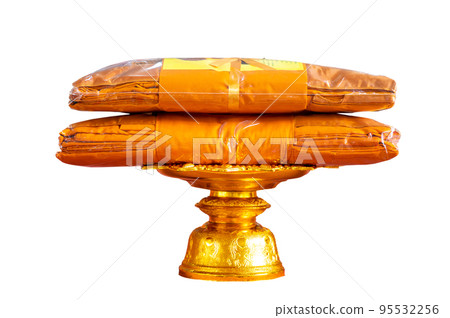 set of monk's robes placed on a pedestal on a white background isolate set of monk's robes placed on a pedestal on a white background isolate 95532256