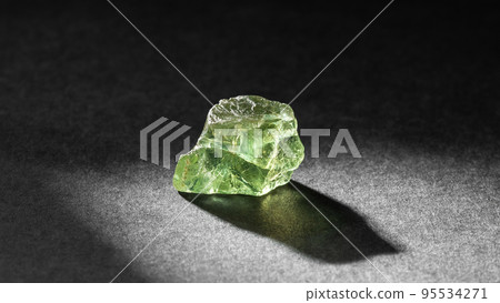 Apatite crystal healing stone on black background 95534271