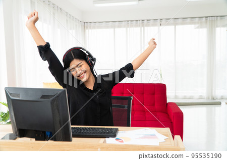 Asian business woman relax after Video Conference for talk to colleagues work from home office, girl student talking by video conference call, female teacher trainer from home at living room Asian business woman relax after Video Conference for talk to colleagues work from home office, girl student talking by video conference call, female teacher trainer from home at living room 95535190
