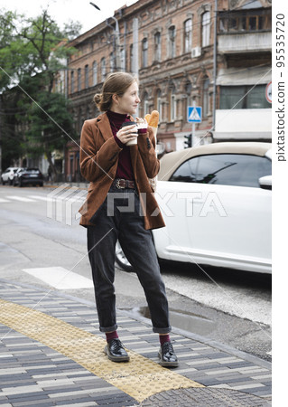 beautiful girl with baguettes and coffee beautiful girl with baguettes and coffee 95535720