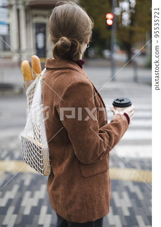 beautiful girl with baguettes and coffee beautiful girl with baguettes and coffee 95535721