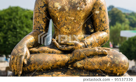 hand of Buddha statue. The peace of the Buddha. Statue of Buddha sitting in meditation 95537330