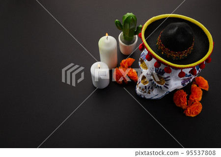 Dia de muertos - day of dead altar concept. Composition of sugar skulls, white candles and flowers, Dia de muertos - day of dead altar concept. Composition of sugar skulls, white candles and flowers, 95537808