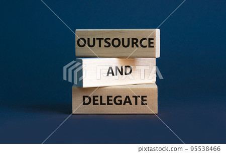 Outsource and delegate symbol. Concept words 'Outsource and delegate'. Beautiful grey background. Business, outsource and delegate concept, copy space. 95538466