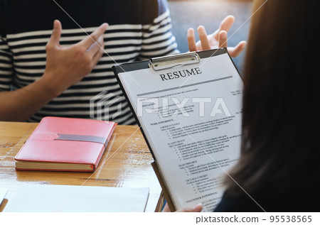 focus resume document with HR discussion job interview with answers from women applying for jobs 95538565