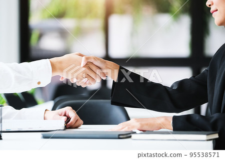 Young businessmen collaborate with partners to increase their business investment network for Plans to improve quality next month in their office. agreement concept 95538571