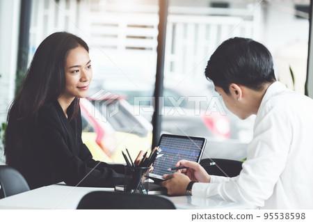 Two business executives are discussing to change their business concept to increase profits and the strength of their business 95538598
