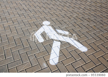 Road sign for pedestrians on paving slabs Road sign for pedestrians on paving slabs 95539060