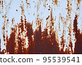 An old metal shield is painted gray with rust and cracks. 95539541