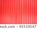 Red iron metal sheet with vertical stripes. 95539547