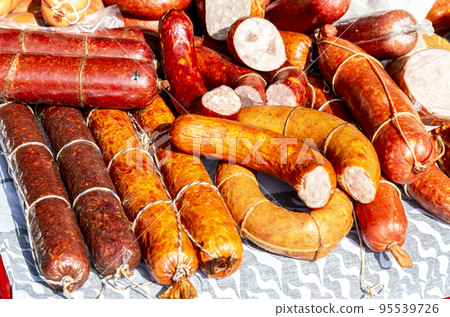 Smoked sausages at the outdoors farmers market 95539726
