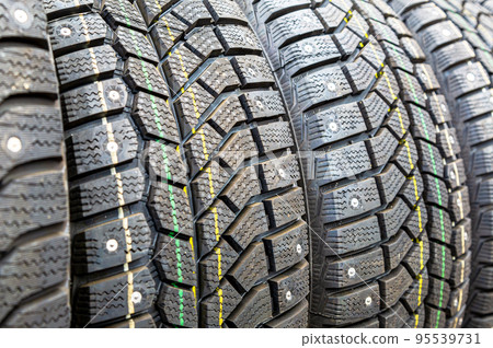 Winter vehicle tires stacked up for sale in the superstore 95539731