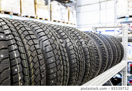 Winter vehicle tires stacked up for sale in the superstore 95539732