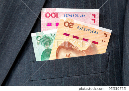 Banknotes of Chinese currency in business suit pocket Banknotes of Chinese currency in business suit pocket 95539735