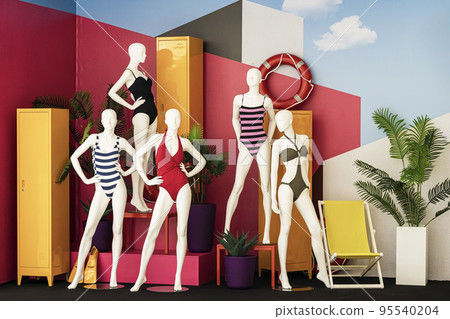 Female mannequins in colorful swimsuits in clothes shop. Summer sale. Shopping, leisure and vacation 95540204