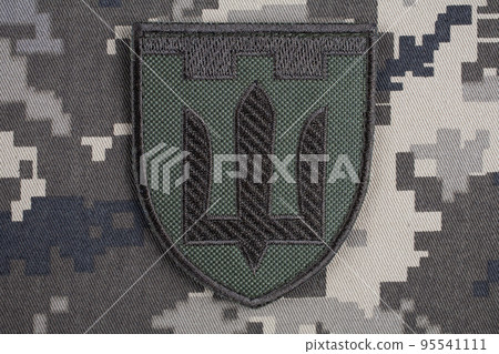 KYIV, UKRAINE - October 6, 2022. Russian invasion in Ukraine 2022. Territorial Defence Forces of Ukraine uniform insignia badge. 95541111