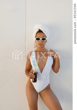 Portrait of gorgeous woman in swimsuit Portrait of gorgeous woman in swimsuit 95541594