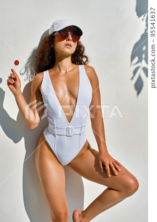 Portrait of trendy fashion woman in swimsuit Portrait of trendy fashion woman in swimsuit 95541637