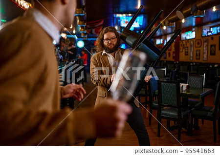 Two man hooligan football team fans get in bar fight Two man hooligan football team fans get in bar fight 95541663
