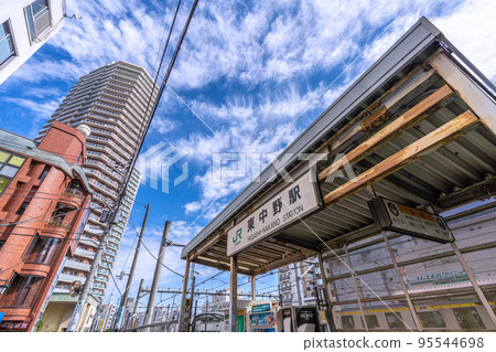 The cityscape of Tokyo in Japan, with a view of Higashi Nakano Station, tower apartments, etc. The cityscape of Tokyo in Japan, with a view of Higashi Nakano Station, tower apartments, etc. 95544698