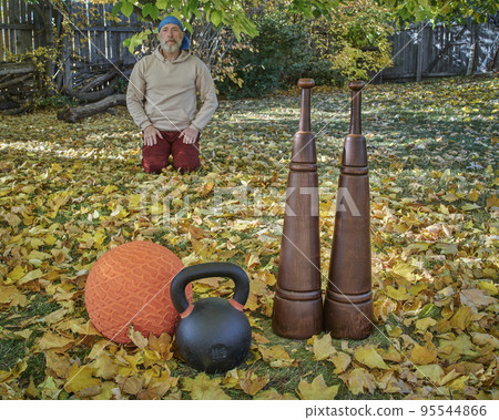 heavy iron kettlebell, slam ball and wooden Persian clubs heavy iron kettlebell, slam ball and wooden Persian clubs 95544866