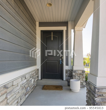 Square Black front door exterior of a house with lockbox and doormat 95545813