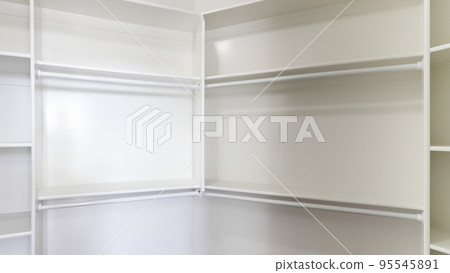 Panorama White built in wall mount shelving unit in a walk in closet 95545891