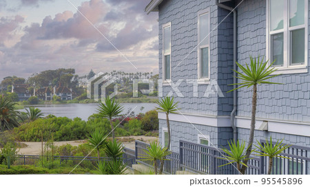 Panorama Puffy clouds at sunset Stone tiles pavement in a residential area at La Jolla, Californ 95545896