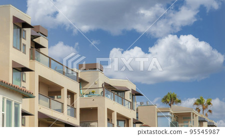 Panorama White puffy clouds Residential buildings with glass railings at La Jolla, Californi Panorama White puffy clouds Residential buildings with glass railings at La Jolla, Californi 95545987
