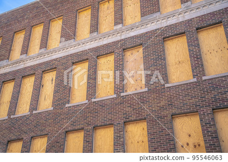Building wall with red bricks and windows with wood panels- San Antonio, Texas 95546063
