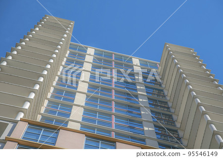 Austin, Texas- Building in a low angle view with reflective glass and terrace on the sides 95546149