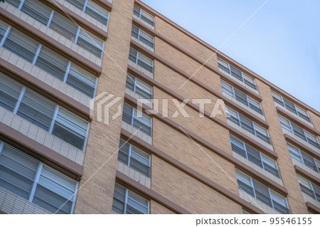Building exterior in a low angle view with brown trims at Austin, Texas 95546155