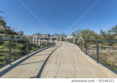 Bike path at the Waterloo park in Austin Texas against blue sky on a sunny day 95546321