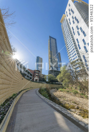Bike path in Austin Texas with view of the city skyline against blue sky 95546322