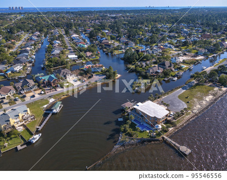 Aerial view of a residential community in Navarre Florida with homes by the bay 95546556