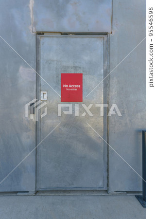 Bright red No Access signage on a shiny door at Waterloo Park Austin Texas 95546598