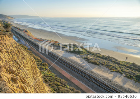 Del Mar Southern California beach landscape with railroad along sea and cliff Del Mar Southern California beach landscape with railroad along sea and cliff 95546636