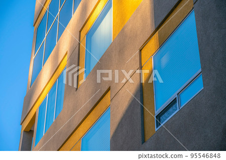 Modern apartment building exterior with picture windows at downtown Tucson, Arizona Modern apartment building exterior with picture windows at downtown Tucson, Arizona 95546848