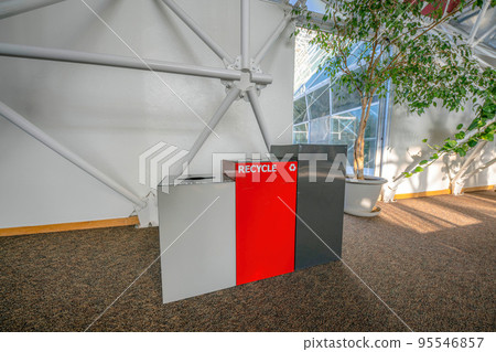 Three trash bins on a brown granite flooring inside a building in Tucson, Arizona Three trash bins on a brown granite flooring inside a building in Tucson, Arizona 95546857